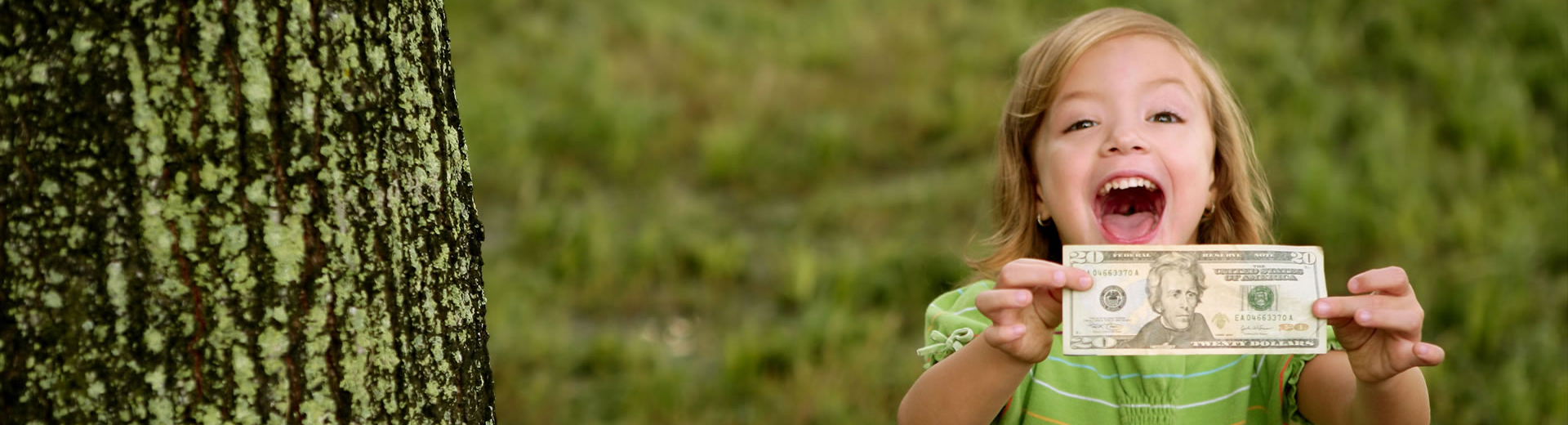 little girl with 20 dollar bill